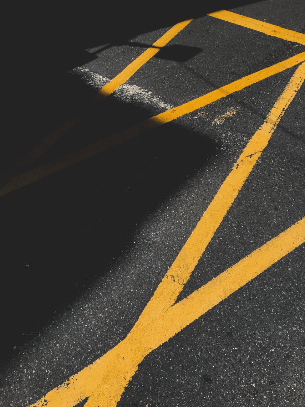 asphalt road with yellow lane